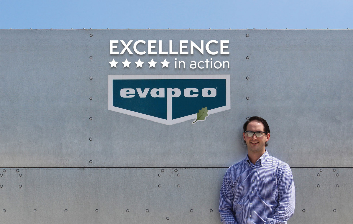Employee standing in front of EVAPCO Cooling Tower (HVAC)